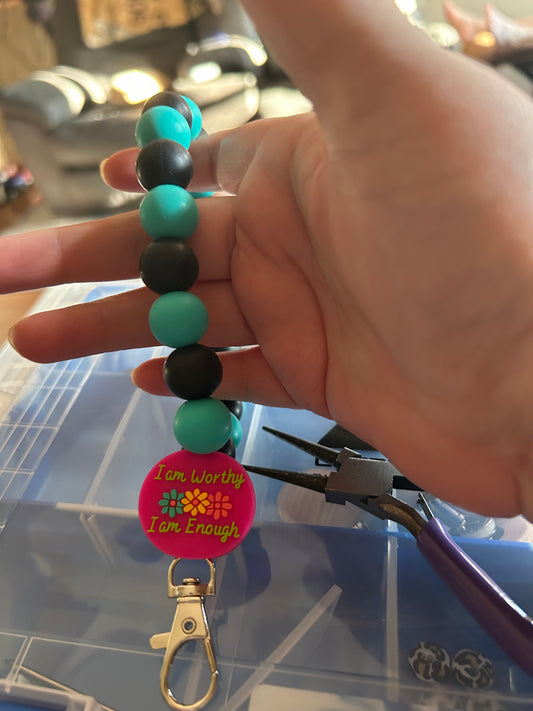 Turquoise and black I am worthy teardrop wristlet