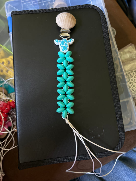Turquoise cow head pacifier clip
